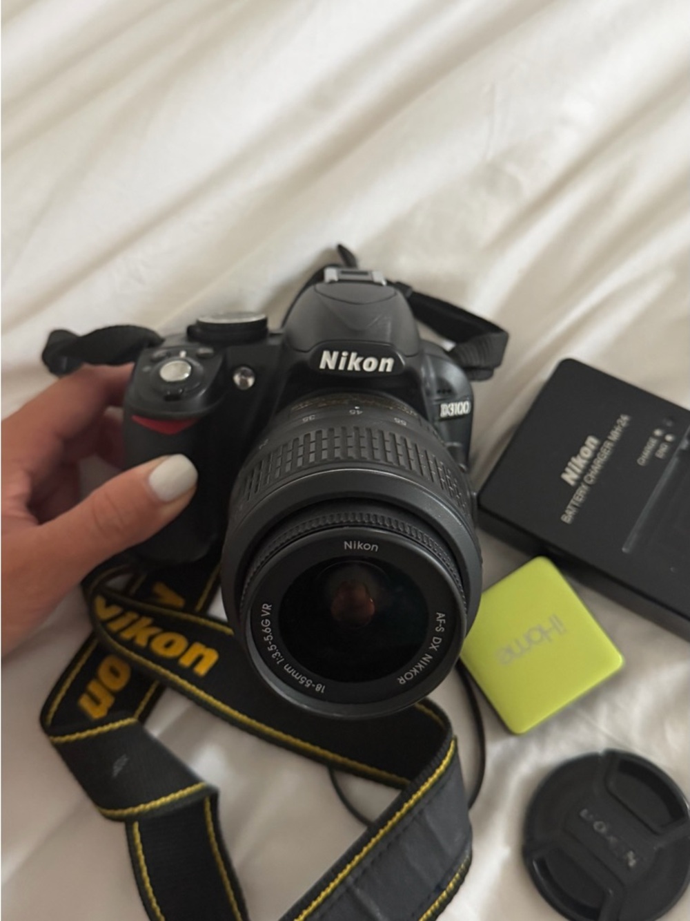Nikon DSLR Camera with Black Body and Yellow-Accented Strap